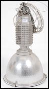 An Industrial factory pendant light with half moon shade in the manner of Zumbotel. Complete with