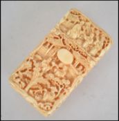 A 19th century Chinese Ivory card case being carve