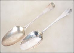 A near pair of George 2nd 18th century silver hallmarked tablespoons. One believed to be by R & S