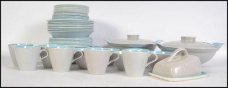 A large quantity of Poole Ice cream and Seagull tableware consisting of cups, saucers, plates,