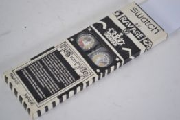 An original 1994 Swatch by Ravage pair of Swatch watches still in the original packaging by Aiglette