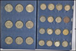 A collection of coins from around the world. Various ages and countries all presented within a