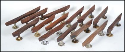 A collection of mid 20th century teak door furniture handles together with other items please see