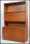 A retro 1970's Danish influenced upright bookcase sideboard cabinet having a breakfront cabinet to