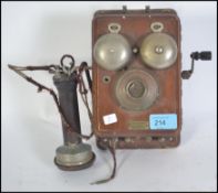 A vintage early 20th century Efesco wall mounted stick telephone with plaque inscribed Efesco with