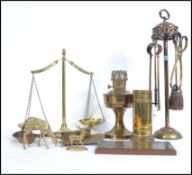 A collection of vintage 20th century brassware's to include table crumber, fireside compendium