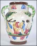 An unusual believed continental Italian faience three-handled vase painted with pastoral figures