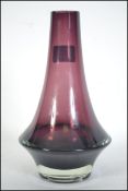 A Danish mid century studio art glass vase of purple coloured form having flared base and tapered