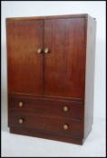A 1950's mid century retro mahogany tallboy linen