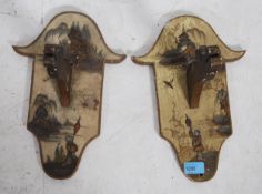 A pair of Japanese  20th century chinoiserie painted wall lantern brackets decorated with scenes