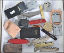 A collection of cigarette lighters and penknives. Lighters to include Champ, Ronsons, Ronson