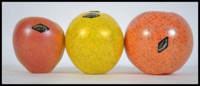 A small group of three 20th century glass paperwei