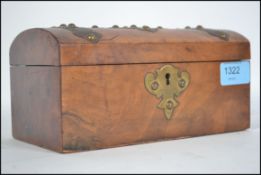 A Victorian walnut tea caddy of rectangular form w