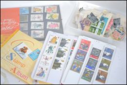 A collection of stamps both loose and in albums from around the world to include stamps dating