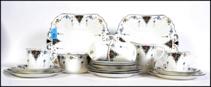 A 1930's Art Deco Shelley 5 piece ceramic tea service in a stunning pattern comprising cups,