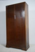 A 1930's Art Deco Compactom ( Blue spot ) double wardrobe having fully fitted and lined interior