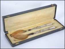 A silver handled early 20th century bone serving s
