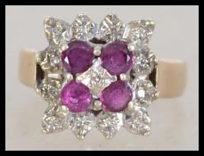 A vintage ladies 9ct gold and ruby diamond ring of