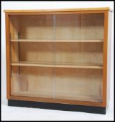 A retro 20th century glazed open faced walnut book