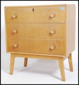 A 1960's G-Plan Ernest Gomme natural oak  series ' secretaire ' chest of drawers. Raised on