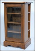 A contemporary Ercol ' Golden Dawn ' pedestal upri