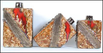 A set of three retro 20th century fat lava graduating salt glazed vases of square and angular form