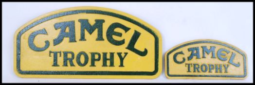 Two vintage style, 20th century cast iron wall plaques of Camel Trophy signs. Biggest measures