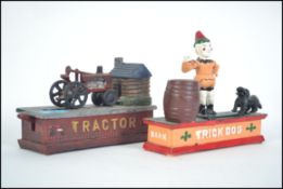 2 vintage style cast iron painted money boxes to i