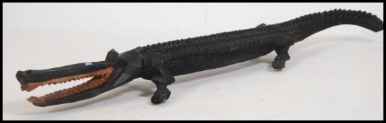 A fantastic 20th century carved ebonised five foot long  Alligator wooden sculpture  purchased