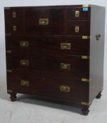 A 20th century antique style mahogany and brass bo