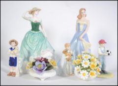 A good group of Royal Doulton figurines to include Taylor HN4496 Emily HN4093 Pride and Joy HN4102