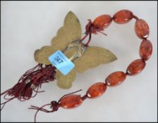 An Asiatic - Chinese 20th century unusual amber st