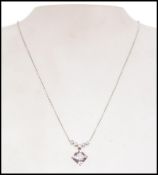 A hallmarked 9ct white and yellow gold necklace and earring suite