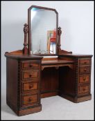 A Victorian Arts & Crafts mahogany inlaid drop cen