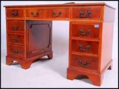 A 20th century contemporary twin pedestal yew wood