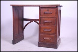 A small 19th century solid oak clerks desk of Industrial form having open kneehole recess with