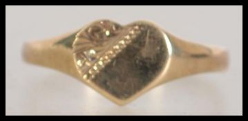A 9ct gold hallmarked band ring with heart shaped