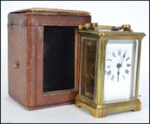 A good early 20th century brass carriage clock complete with leather carry case and key. The