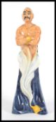 A Royal Doulton large character ceramic figure The Genie HN2989. The Genie stood tall with his