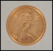 Coins. An Elizabeth II gold Sovereign, 1974.