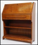 A vintage mid 20th century oak bureau. Having a fu