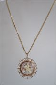 A 9ct gold hallmarked ( Birmingham / maker AJ) cameo pendant with fret worked surround set to a