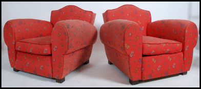 A pair of stunning 1930's Art Deco club armchairs. Of French origin, the chairs with stunning shaped