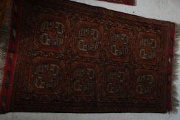 3 early 20th century Persian rugs to include a Bokhara rug with multiple medallions along with a