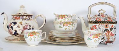 A masons Mandalay teapot together with a similar style teapot and a pair of Art Deco hand painted