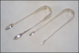 A pair of Georgian 18th century silver hallmarked sugar tongs possibly by John Meek,, London 1823.