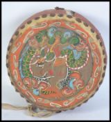 A 20th century Chinese style temple drum having an