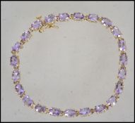 A ladies contemporary 10ct yellow gold and amethys