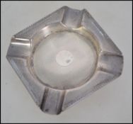 A silver hallmarked ashtray by Walker & Hall having engine turned decoration. Hallmarks for