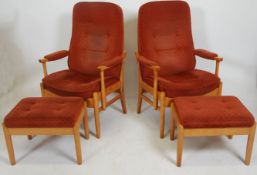 A 20th century contemporary Farstrup Danish pair of armchairs raised on light wood turned supports
